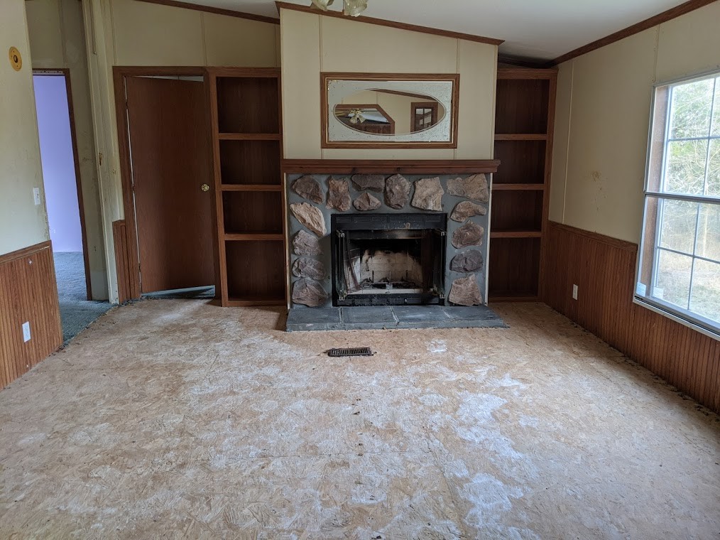 915 Burford Road Lebanon, TN 37087 - Photo 4 of 10 a view of an empty room with window and fire place
