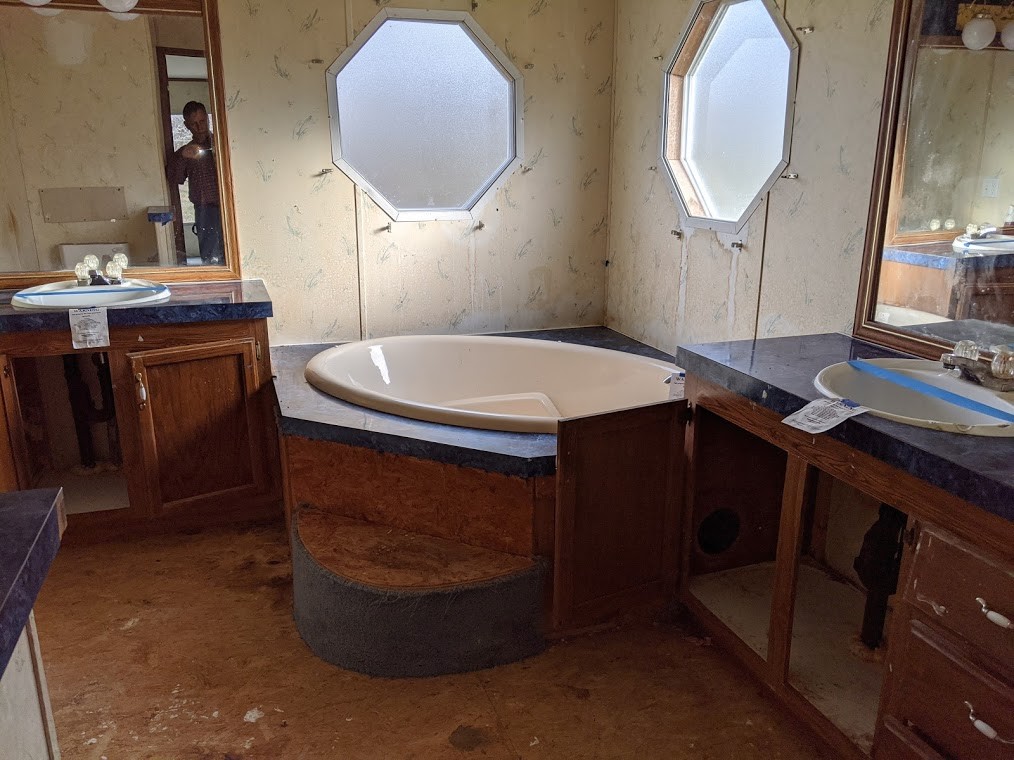 915 Burford Road Lebanon, TN 37087 - Photo 5 of 10 a bathroom with a sink a mirror and a vanity