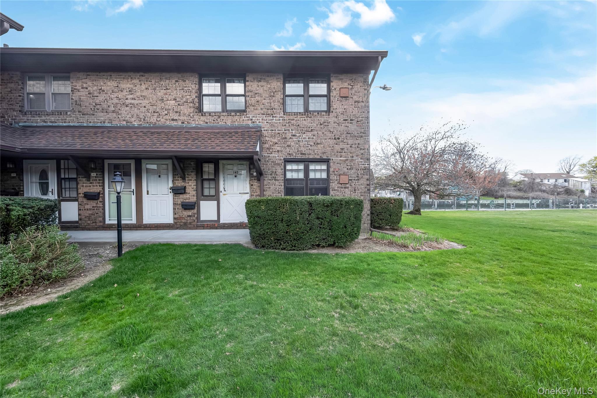 140 Mariners Way Copiague, NY 11726 - Photo 1 of 26 a view of a house with backyard and porch