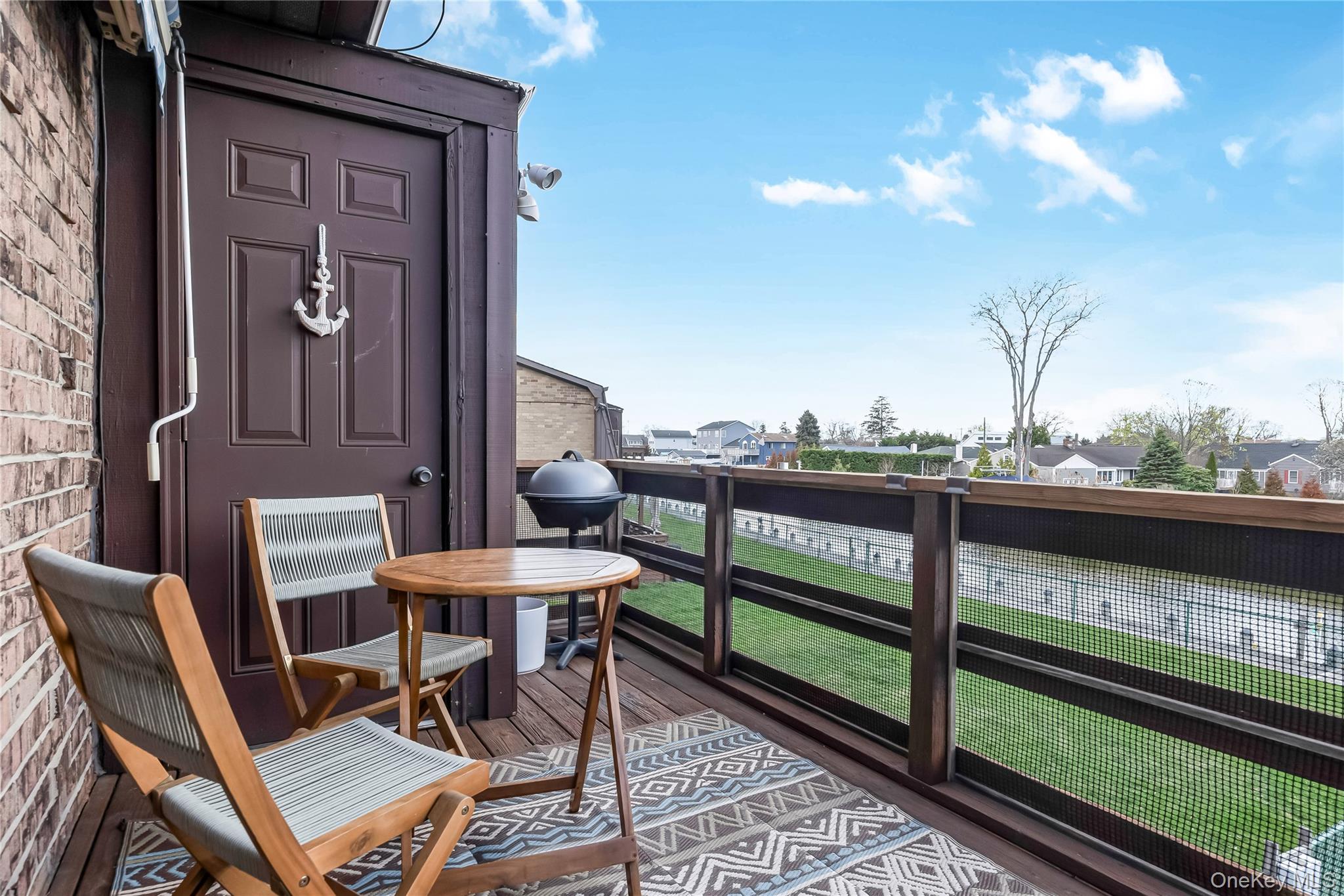 140 Mariners Way Copiague, NY 11726 - Photo 18 of 26 a view of a chairs and table in the balcony