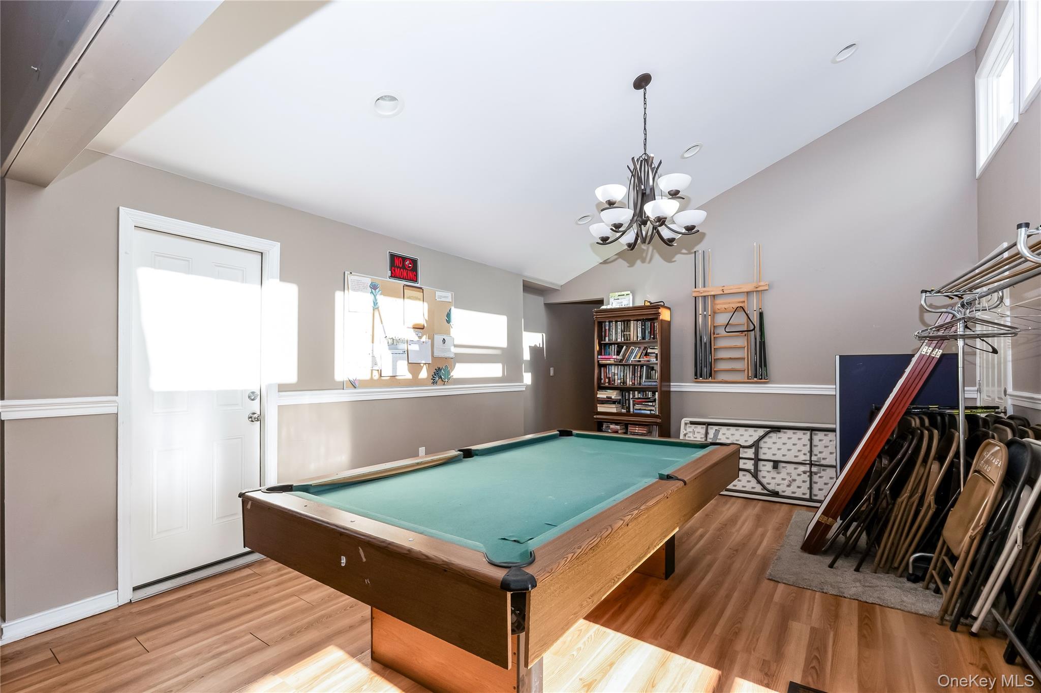 140 Mariners Way Copiague, NY 11726 - Photo 19 of 26 a room with pool table and windows
