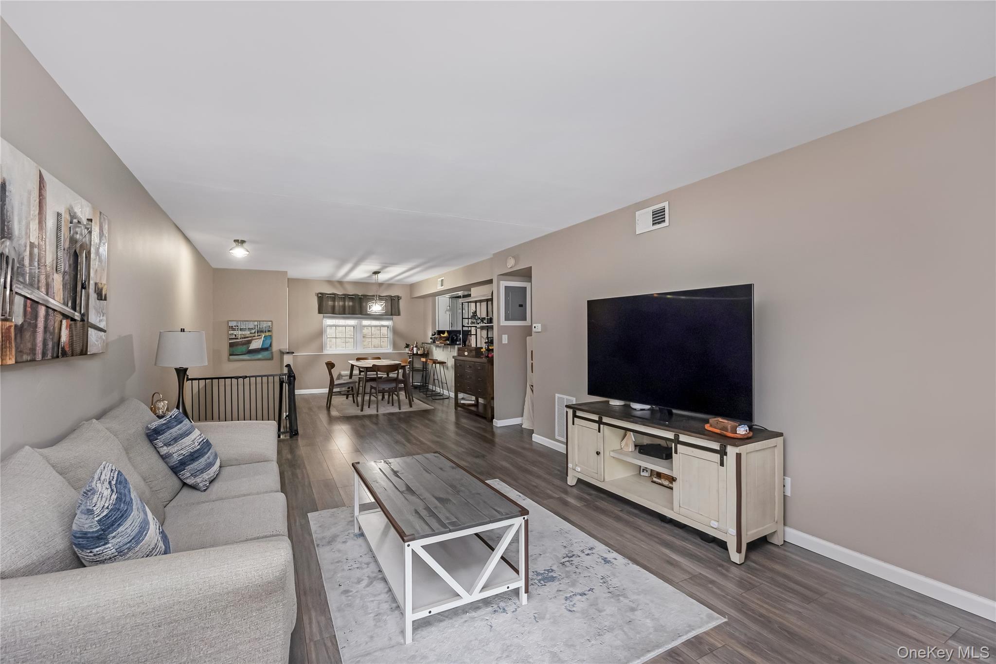 140 Mariners Way Copiague, NY 11726 - Photo 10 of 26 a living room with furniture and a flat screen tv