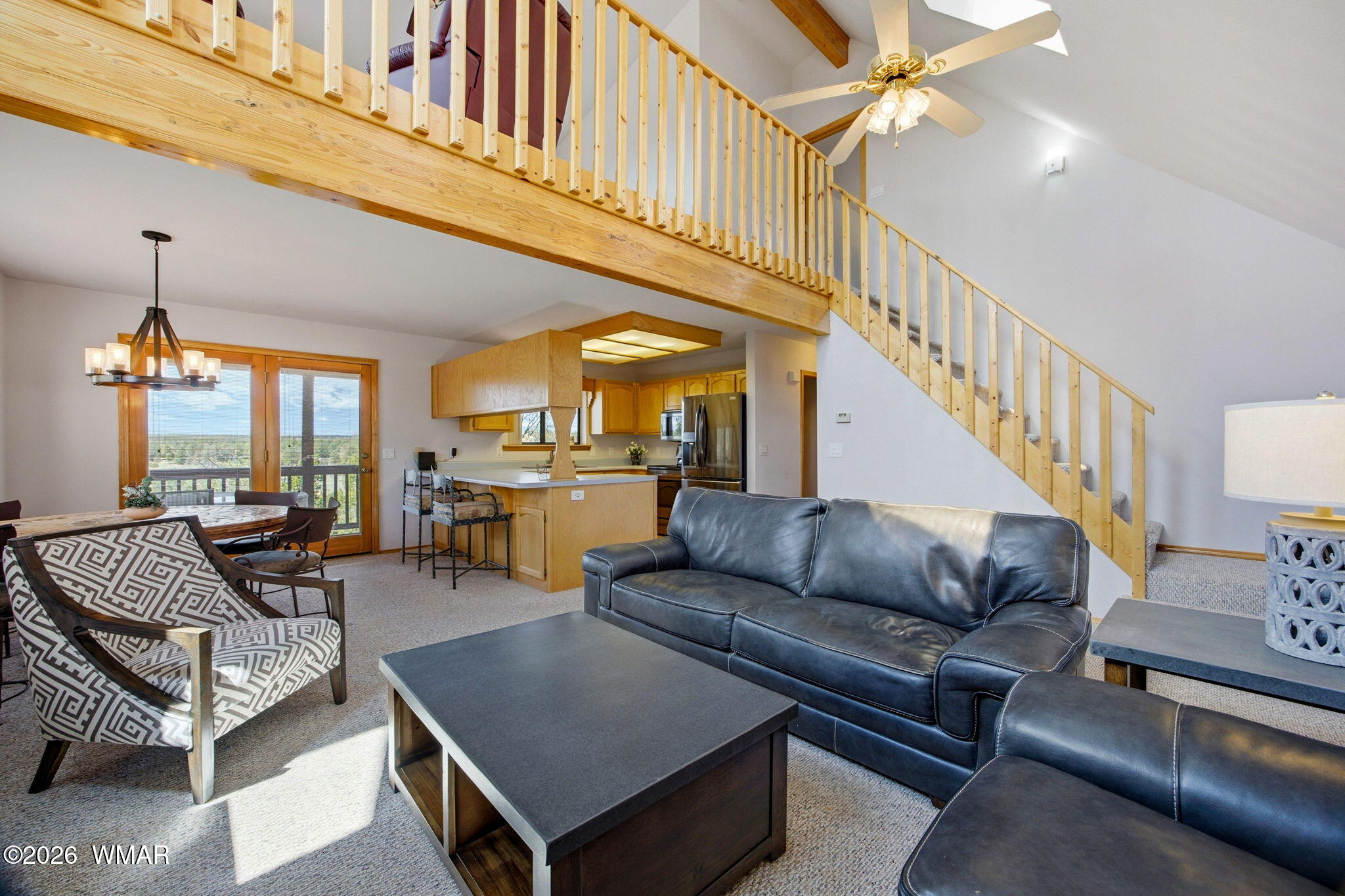 2806 Sky Hawk Drive Overgaard, AZ 85933 - Photo 11 of 43 a living room with furniture ceiling fan and a rug