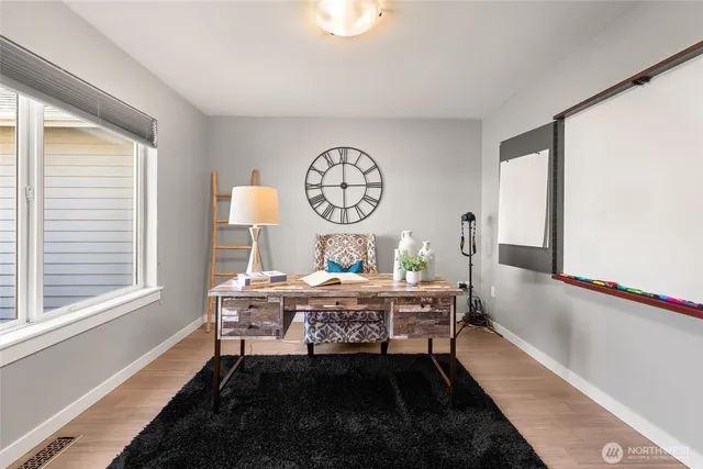 a dining room with a table and a chair