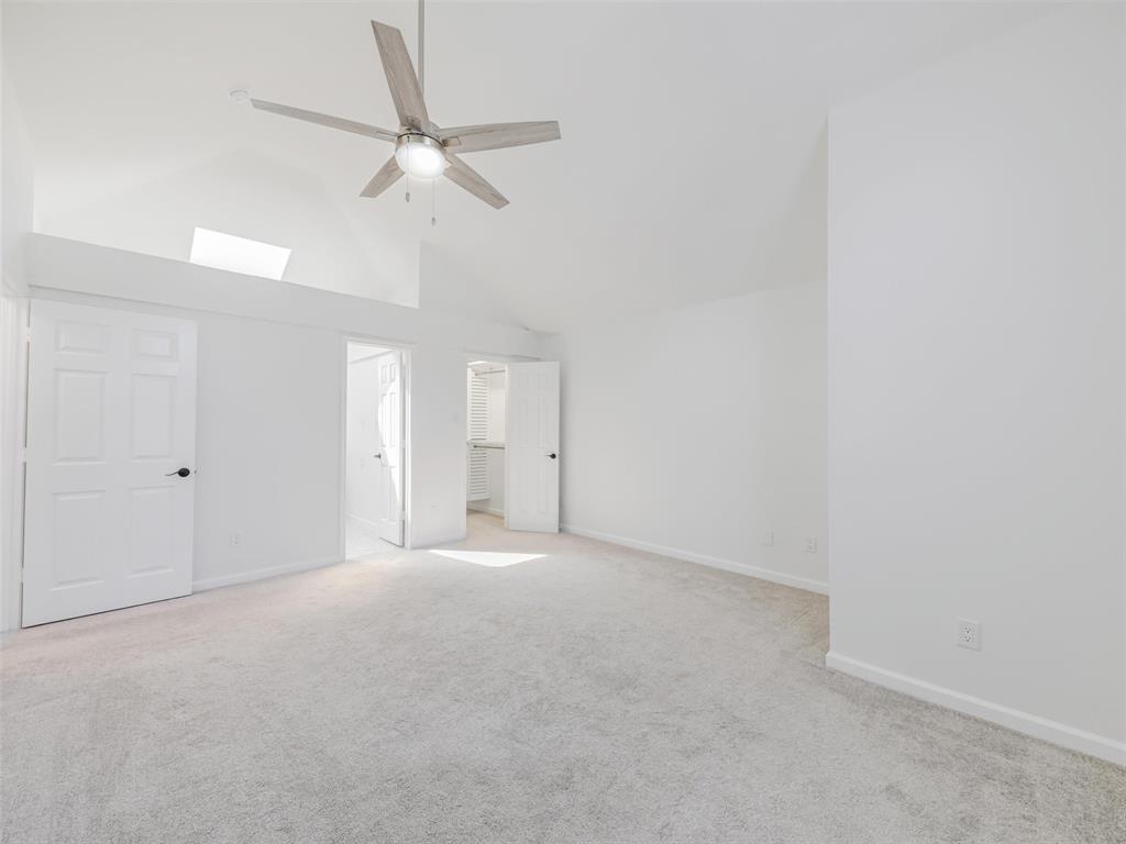 2327 North Ridge Road McKinney, TX 75072 - Photo 16 of 26 Vaulted ceilings featuring a skylight and a ceiling fan