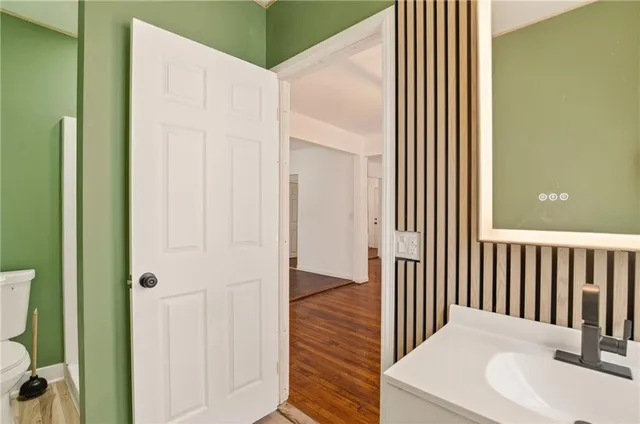 a view of a bathroom from the hallway