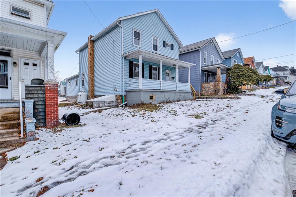 403 9th Street Windber, PA 15963 - Photo 2 of 34 a front view of a house with a yard