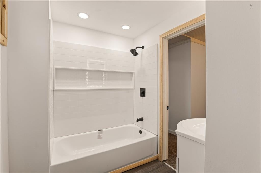 403 9th Street Windber, PA 15963 - Photo 21 of 34 a bathroom with a tub and a shower