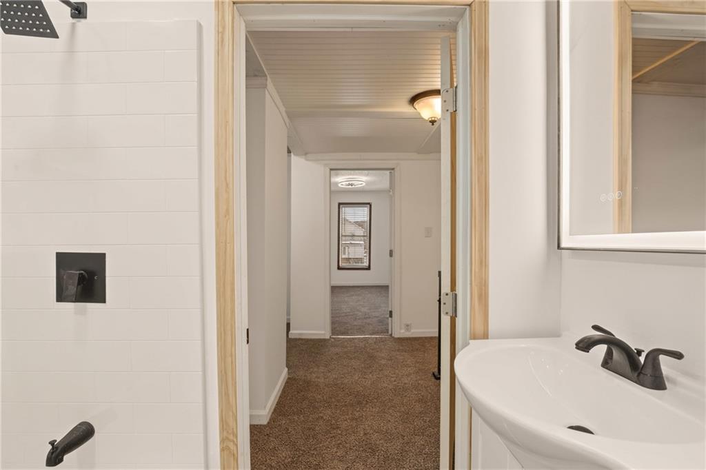 403 9th Street Windber, PA 15963 - Photo 22 of 34 a bathroom with a sink and mirror