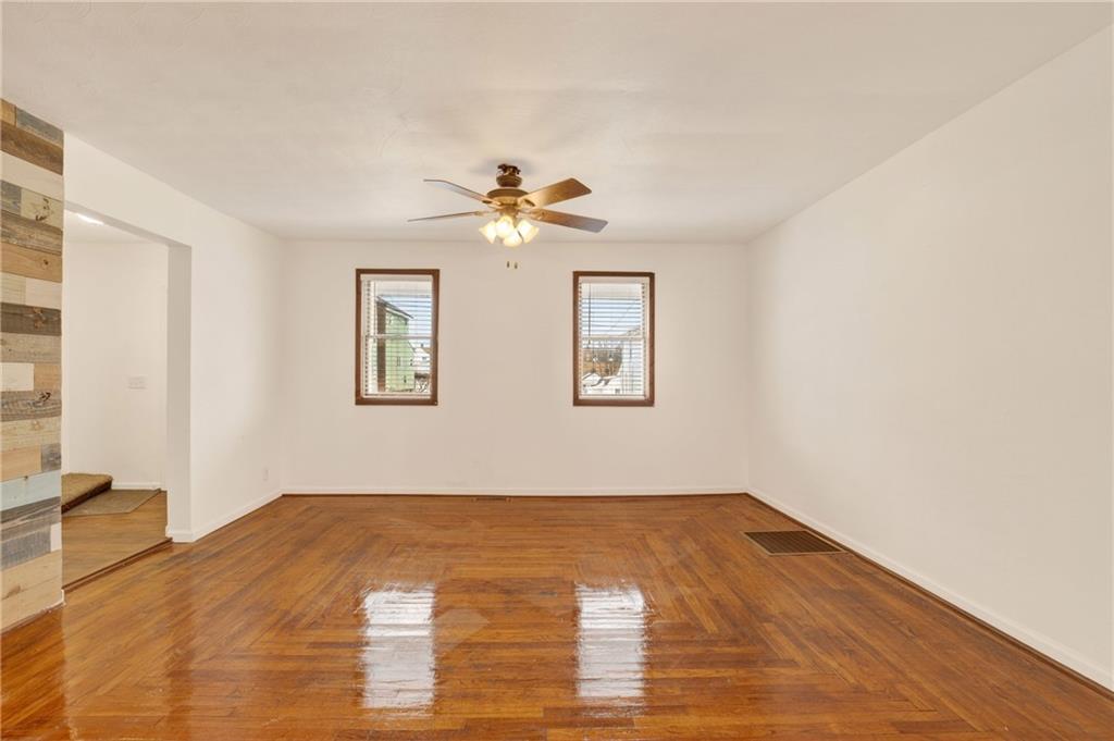 403 9th Street Windber, PA 15963 - Photo 9 of 34 a view of empty room with wooden floor and fan