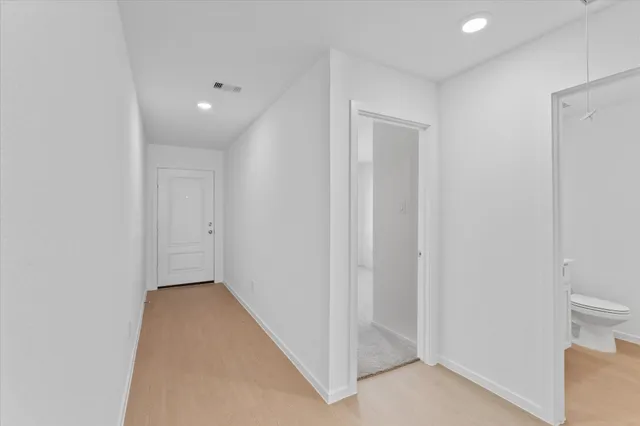 a view of a room with a hallway