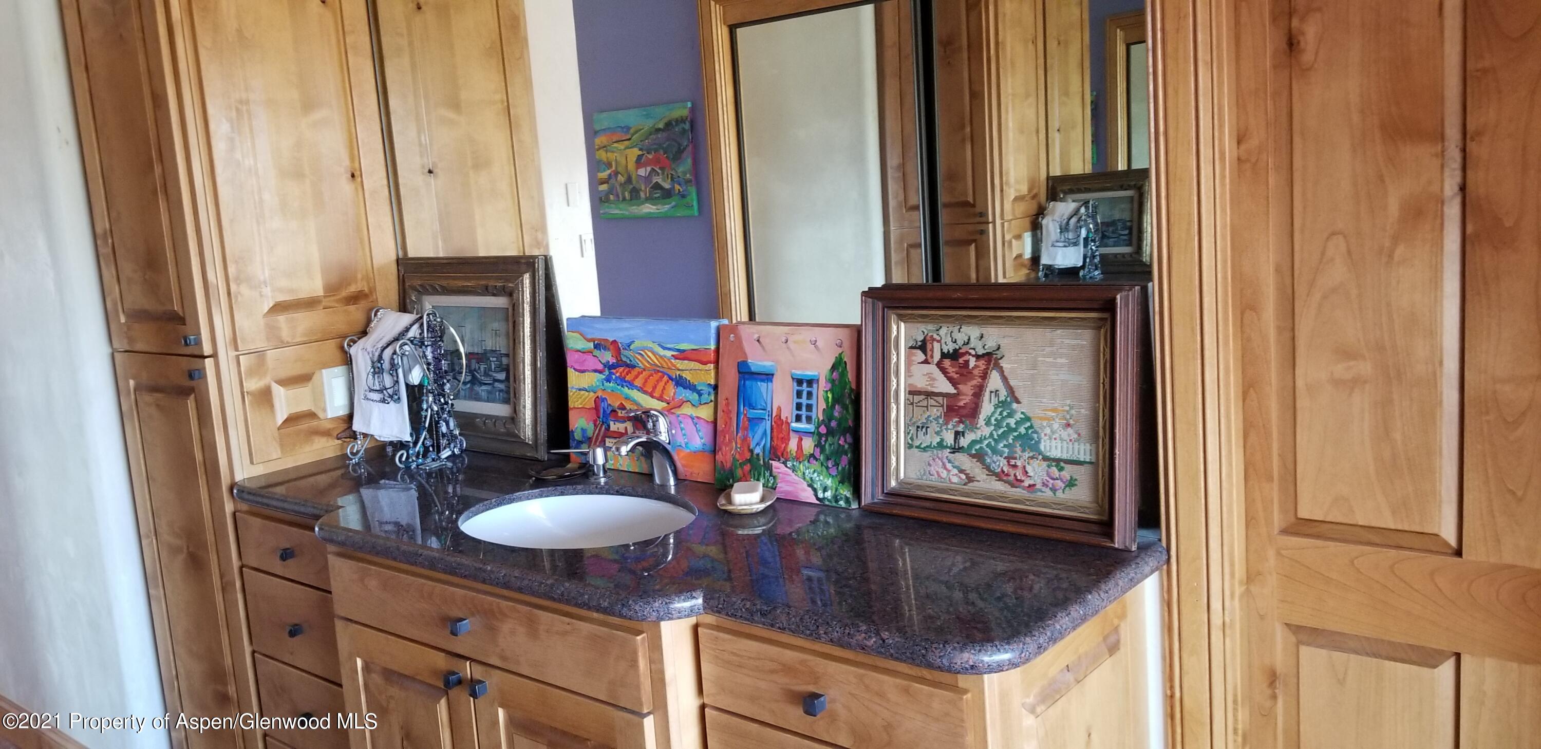 1973 County Road 210 Rifle, CO 81650 - Photo 10 of 12 a bathroom with sinks and a mirror