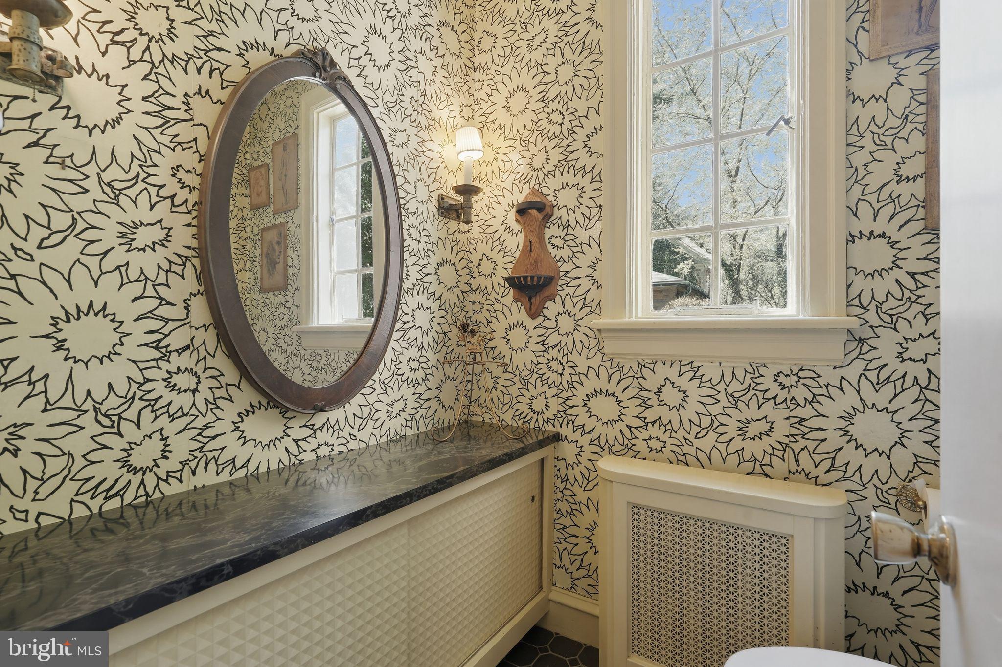 408 Upland Road Elkins Park, PA 19027 - Photo 12 of 41 a bathroom with a sink and a mirror