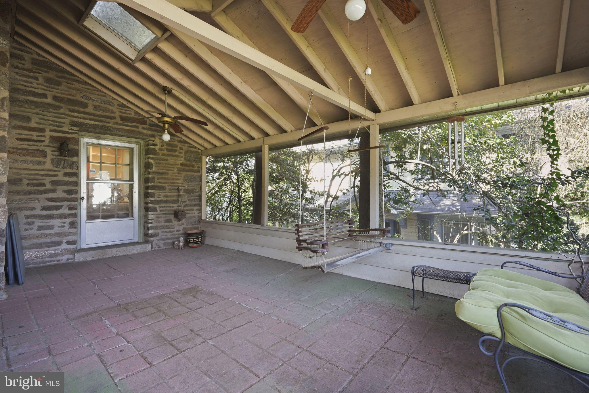 408 Upland Road Elkins Park, PA 19027 - Photo 14 of 41 a view of a patio with table and chairs and wooden floor