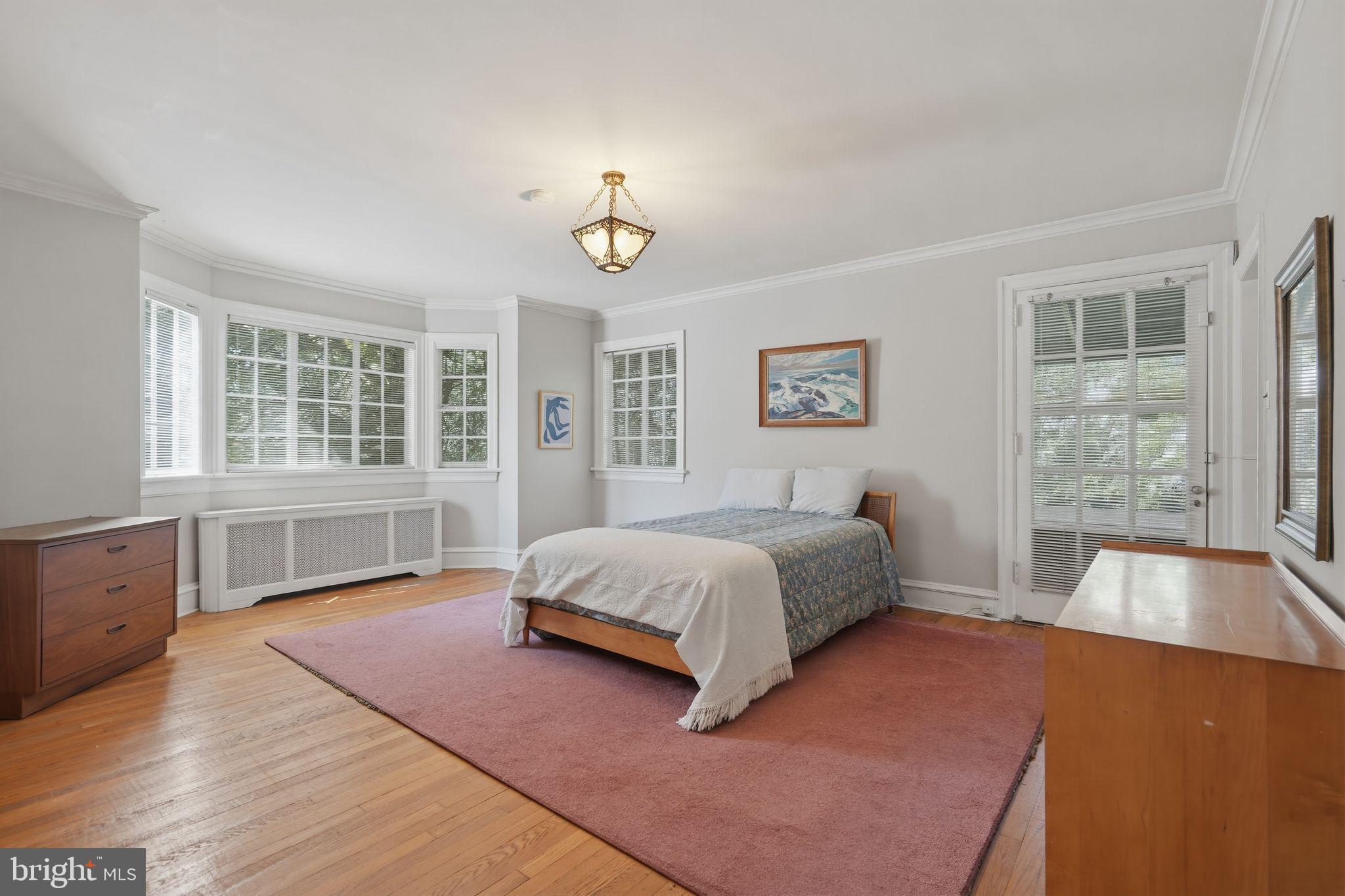 408 Upland Road Elkins Park, PA 19027 - Photo 16 of 41 a spacious bedroom with a large bed and a window