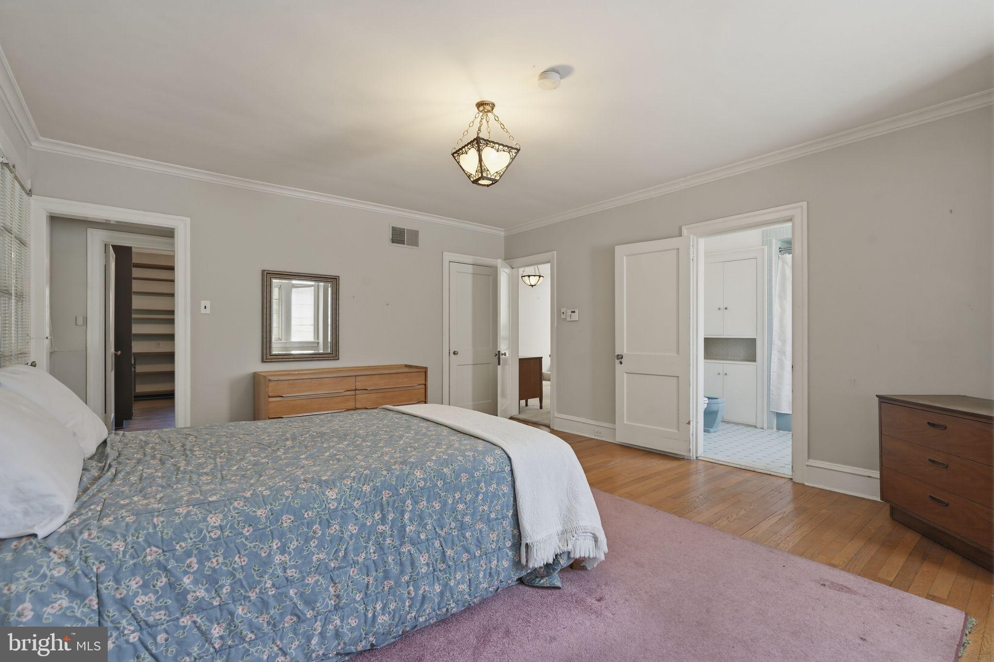 408 Upland Road Elkins Park, PA 19027 - Photo 17 of 41 a bedroom with a bed and a chandelier