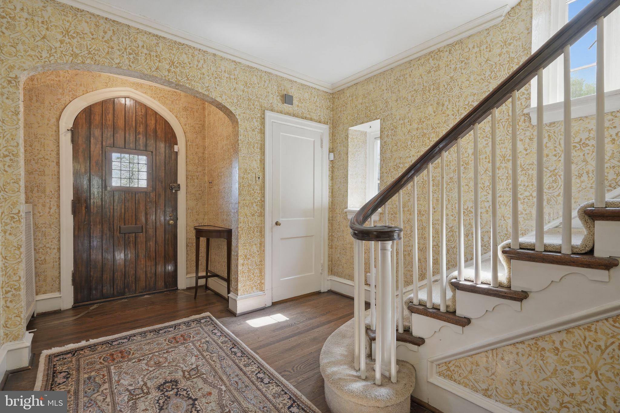 408 Upland Road Elkins Park, PA 19027 - Photo 2 of 41 a view of staircase with white walls and railing next to a window