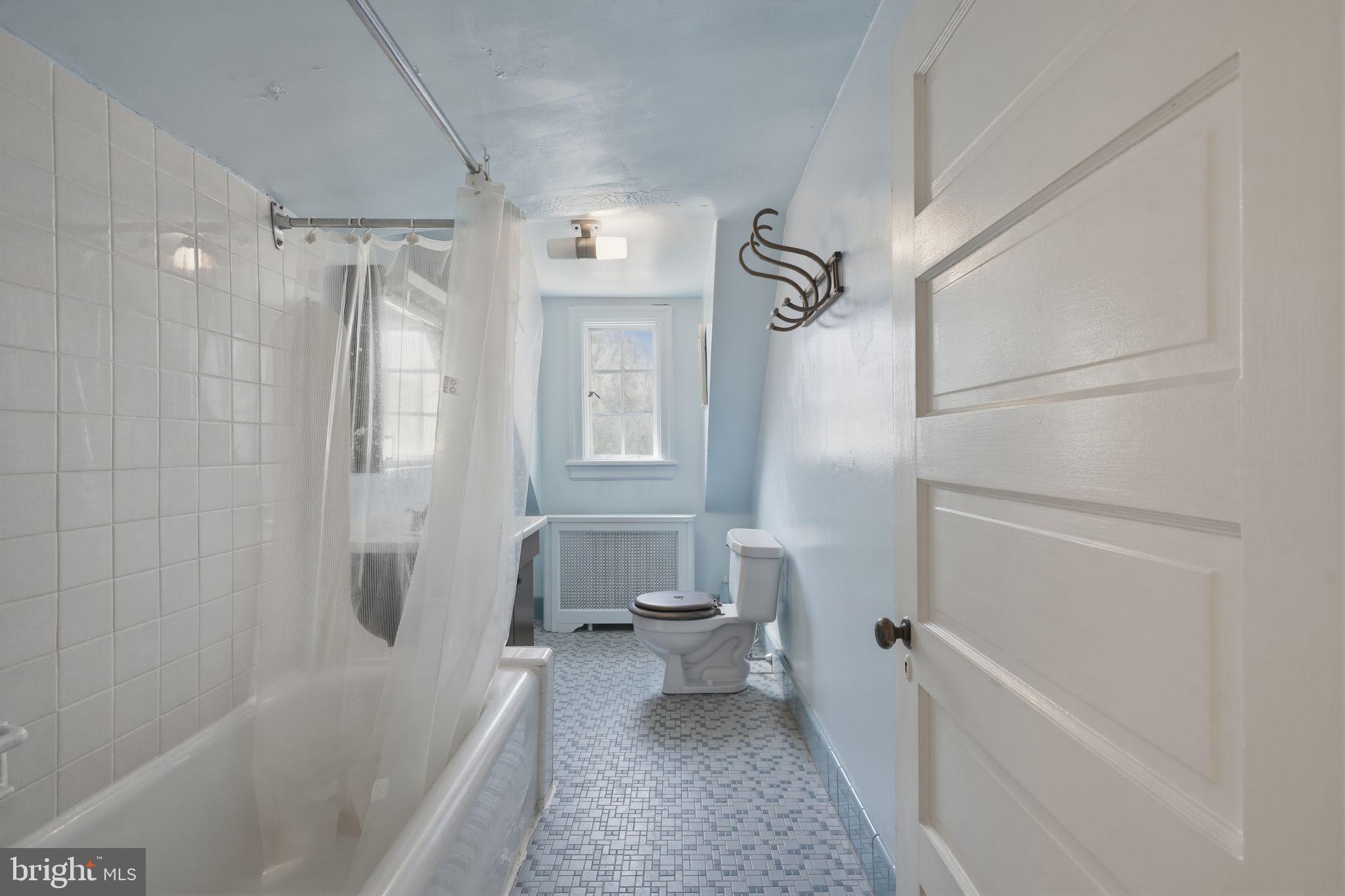 408 Upland Road Elkins Park, PA 19027 - Photo 29 of 41 a bathroom with a tub shower and toilet