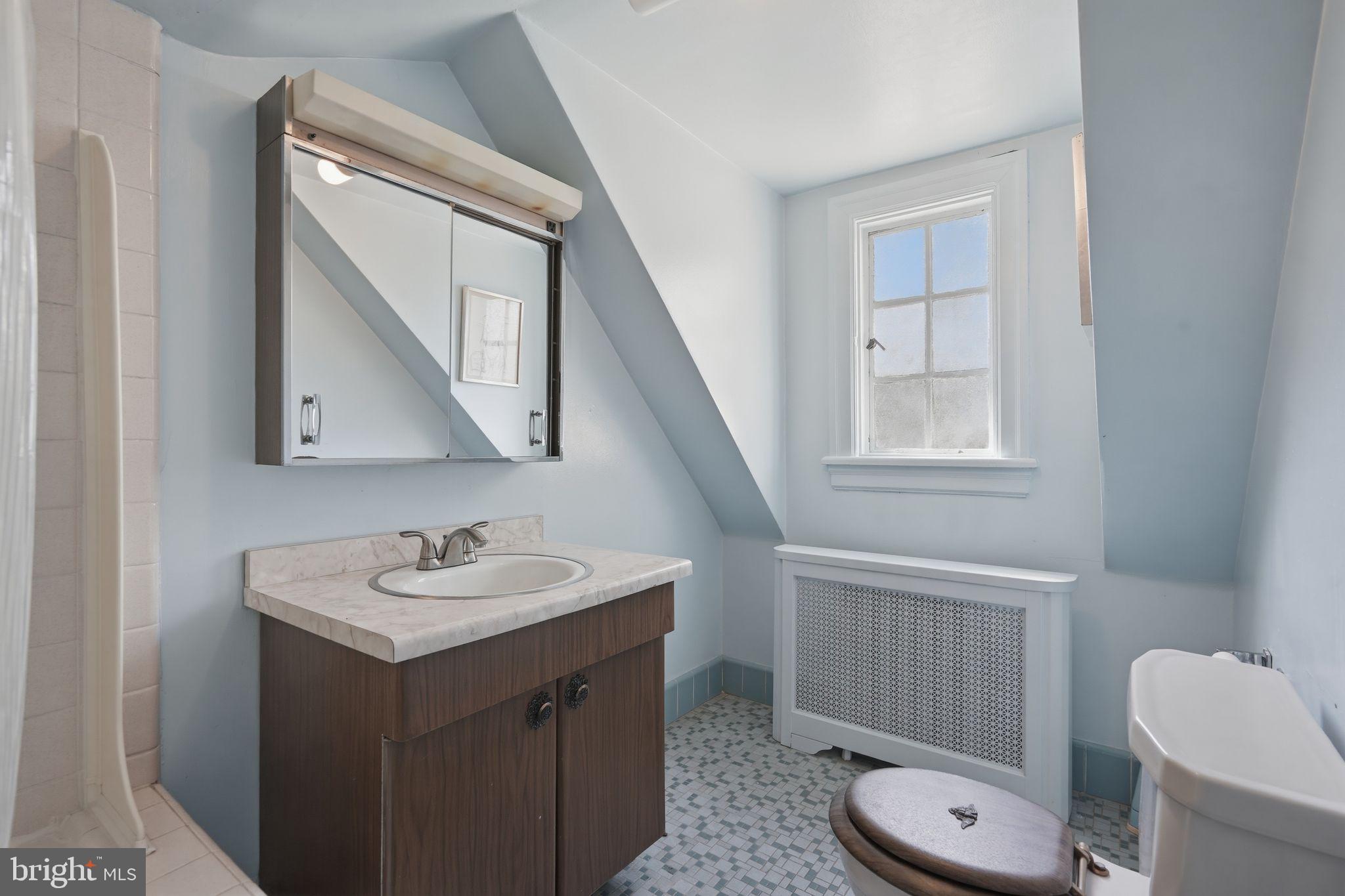 408 Upland Road Elkins Park, PA 19027 - Photo 30 of 41 a bathroom with a sink vanity mirror and toilet