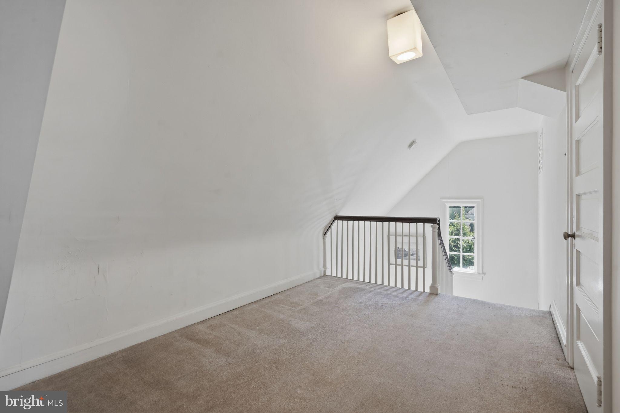408 Upland Road Elkins Park, PA 19027 - Photo 31 of 41 an empty room with staircase and white walls