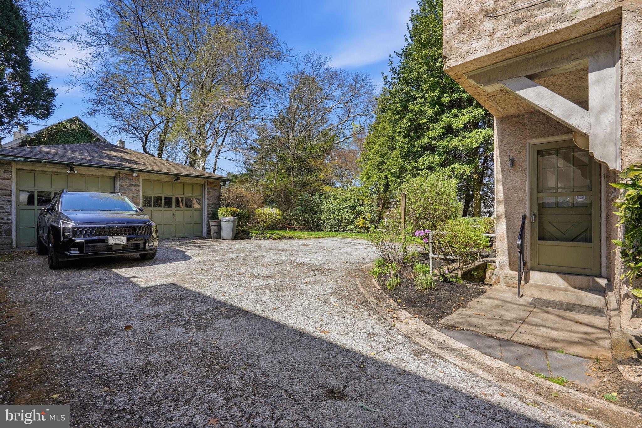 408 Upland Road Elkins Park, PA 19027 - Photo 38 of 41 a front view of a house with a yard and garage