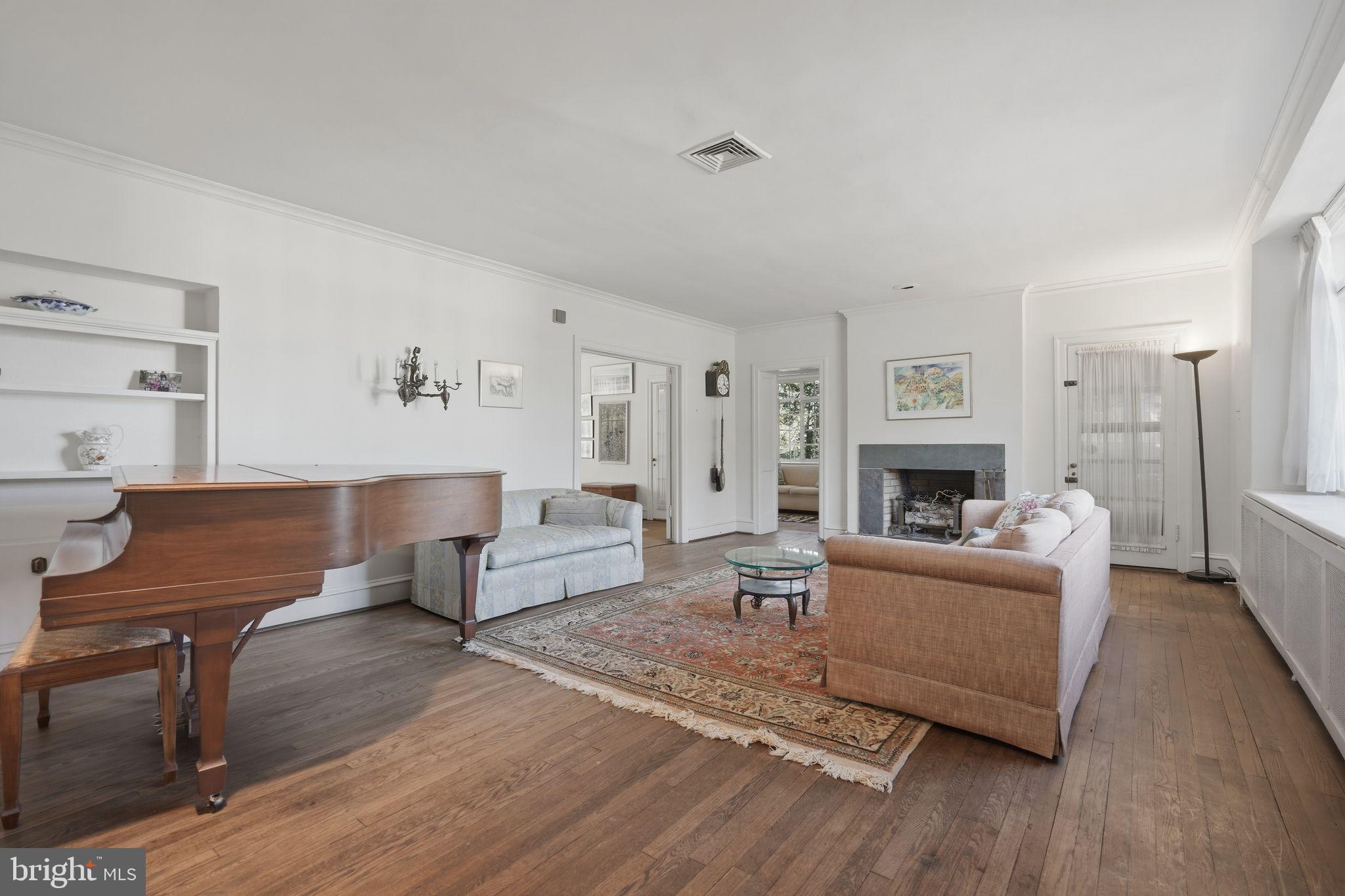 408 Upland Road Elkins Park, PA 19027 - Photo 5 of 41 a living room with furniture and a fireplace