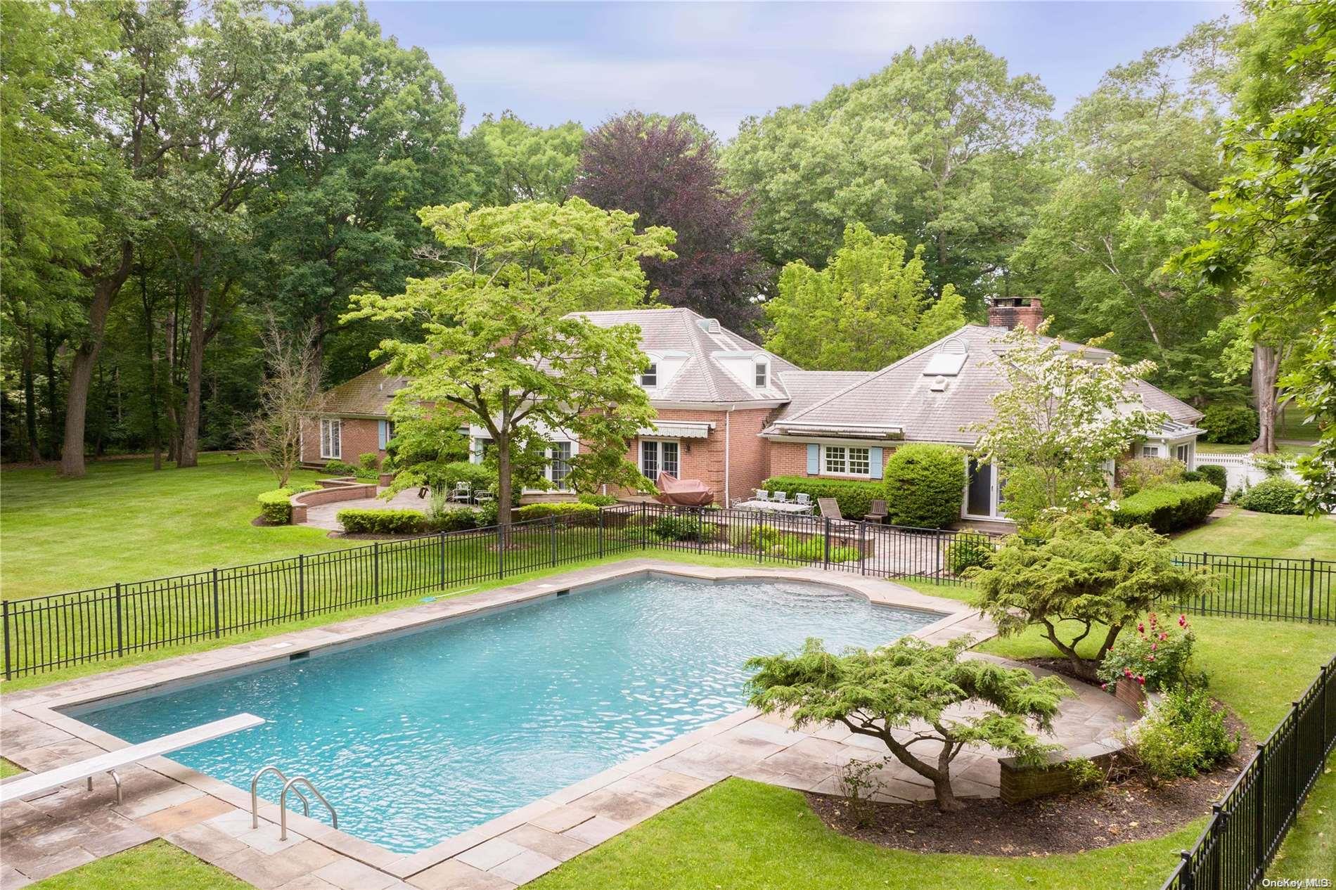 155 Horseshoe Road Mill Neck, NY 11765 - Photo 1 of 1 a view of a swimming pool with a lounge chairs