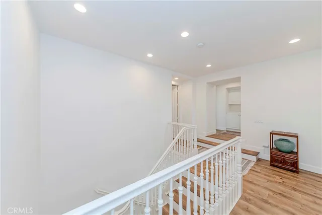 a view of a house with palm trees