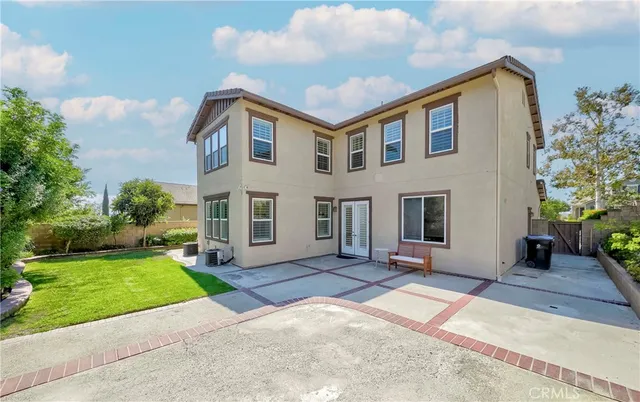 a kitchen with stainless steel appliances kitchen island granite countertop a sink and cabinets