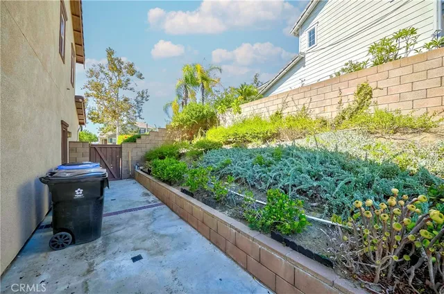 a view of a hallway with a white walls and wooden floor