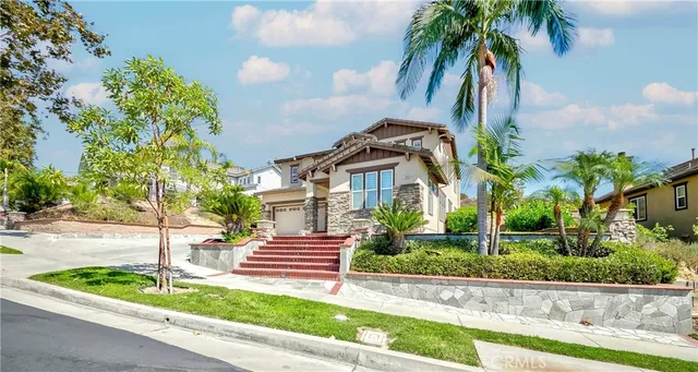 a spacious bathroom with a granite countertop sink a mirror and a bathtub