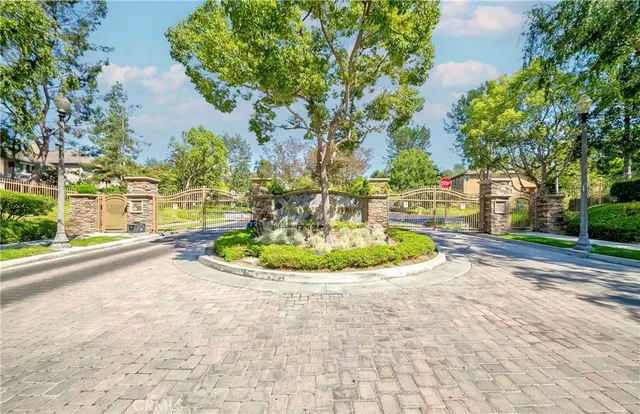 a spacious bedroom with a bed and a flat screen tv