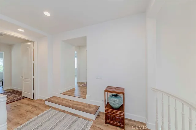 a dining room with furniture and view of kitchen
