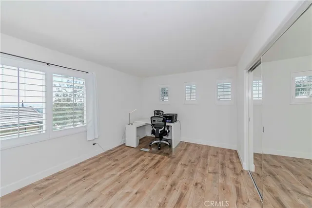 a kitchen with stainless steel appliances a white stove top oven and white cabinets