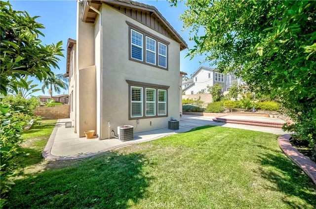 a spacious bathroom with double vanity sink a mirror and a shower