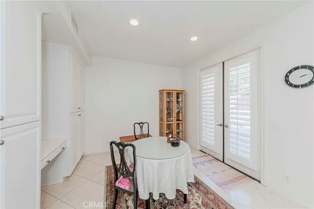 a room with furniture a table and a chandelier