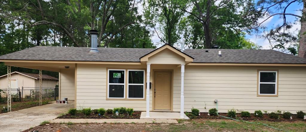 205 Roy Street Minden, LA 71055 - Photo 1 of 8 a front view of a house with a yard