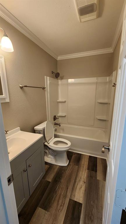205 Roy Street Minden, LA 71055 - Photo 7 of 8 a bathroom with a sink a toilet a mirror and shower