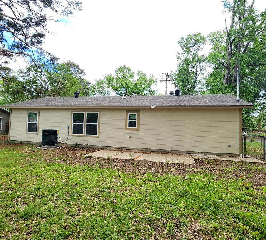 205 Roy Street Minden, LA 71055 - Photo 8 of 8 a backyard of a house with yard and barbeque oven