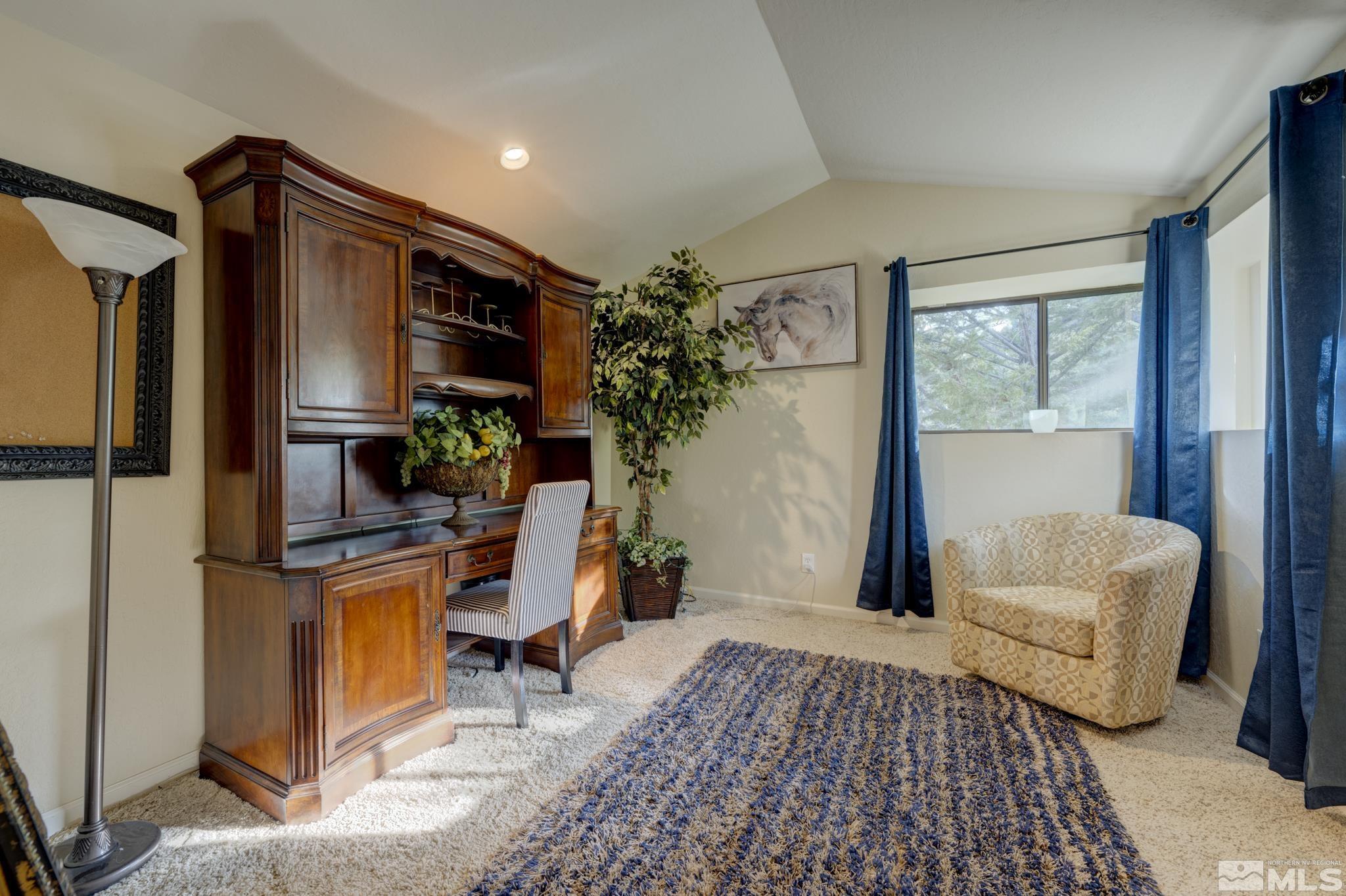 3760 Paradise View Carson City, NV 89703 - Photo 14 of 40 a bedroom with furniture and a window