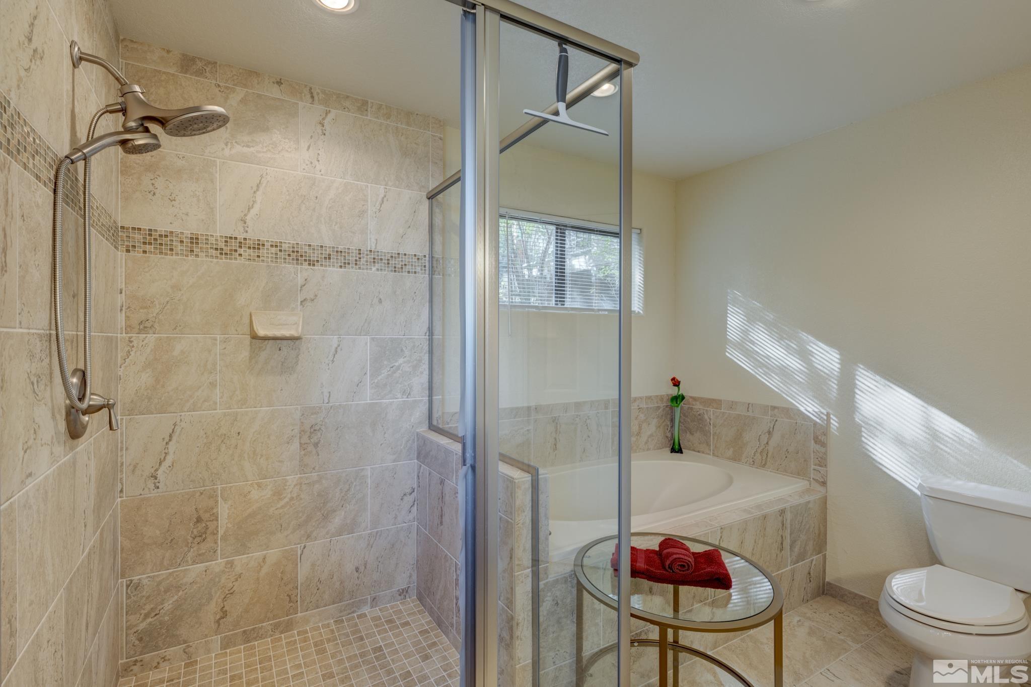 3760 Paradise View Carson City, NV 89703 - Photo 20 of 40 a bathroom with a toilet and a shower