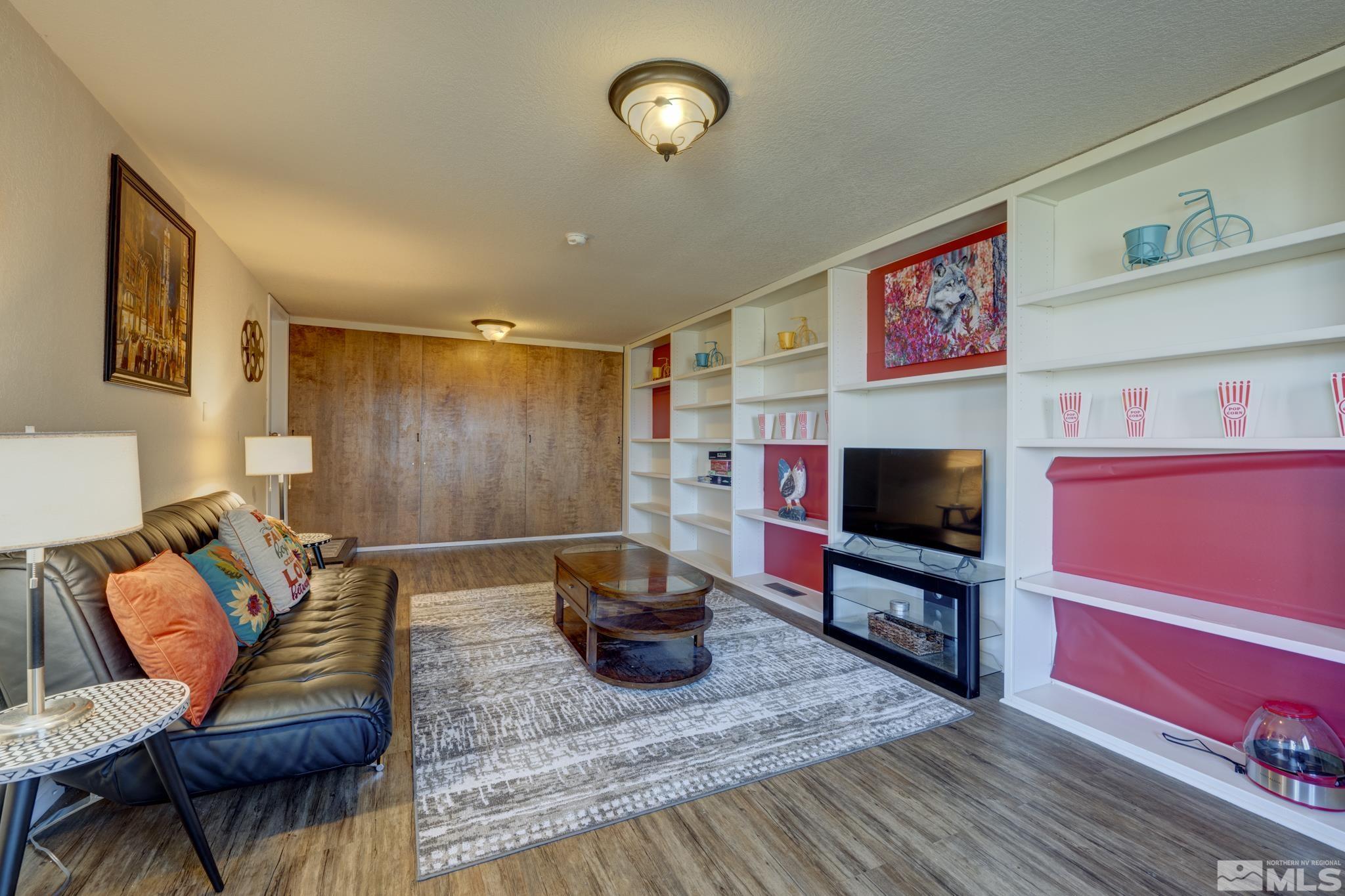 3760 Paradise View Carson City, NV 89703 - Photo 23 of 40 a living room with furniture and a flat screen tv