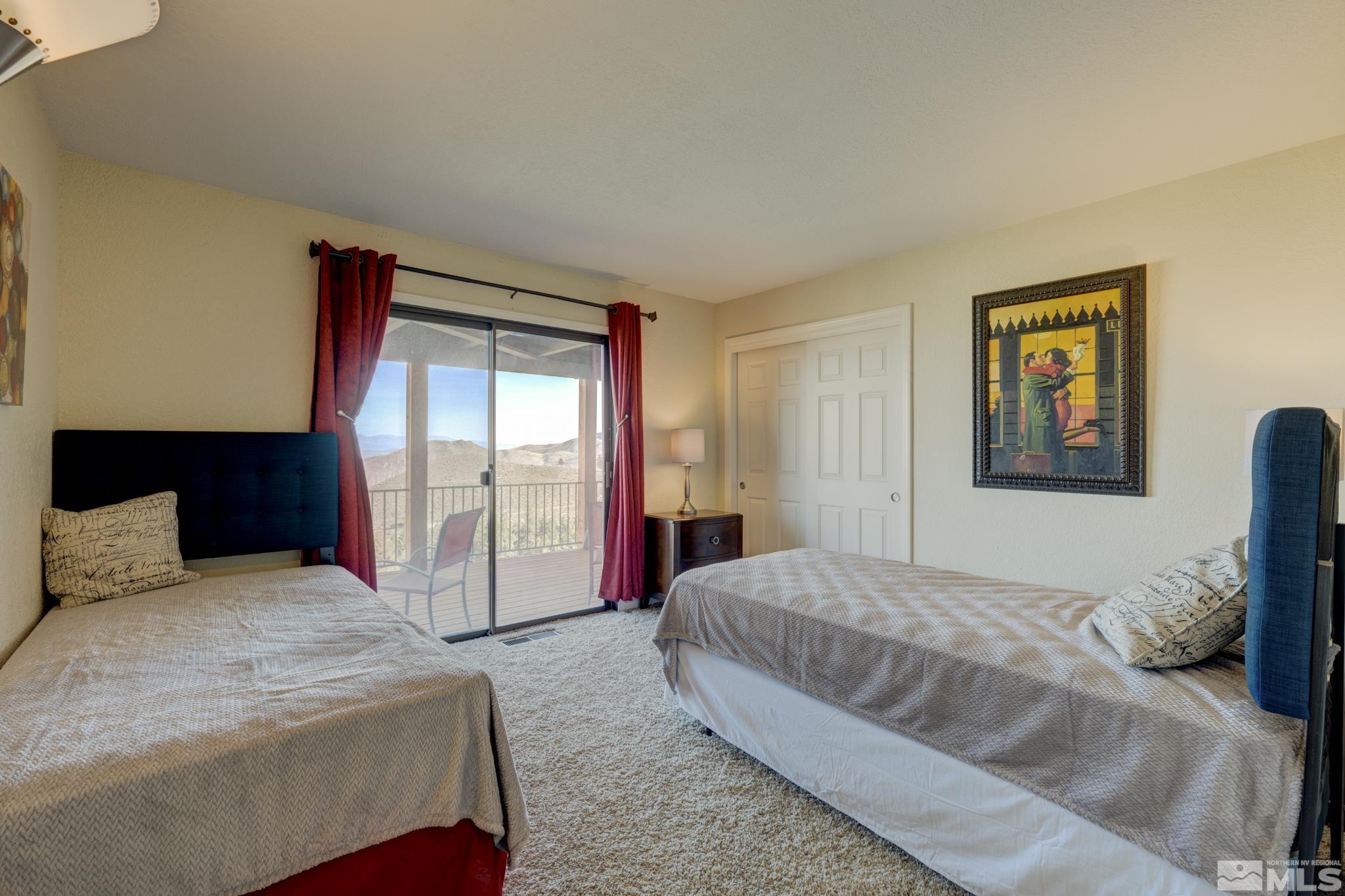 3760 Paradise View Carson City, NV 89703 - Photo 26 of 40 a spacious bedroom with a bed and a dresser