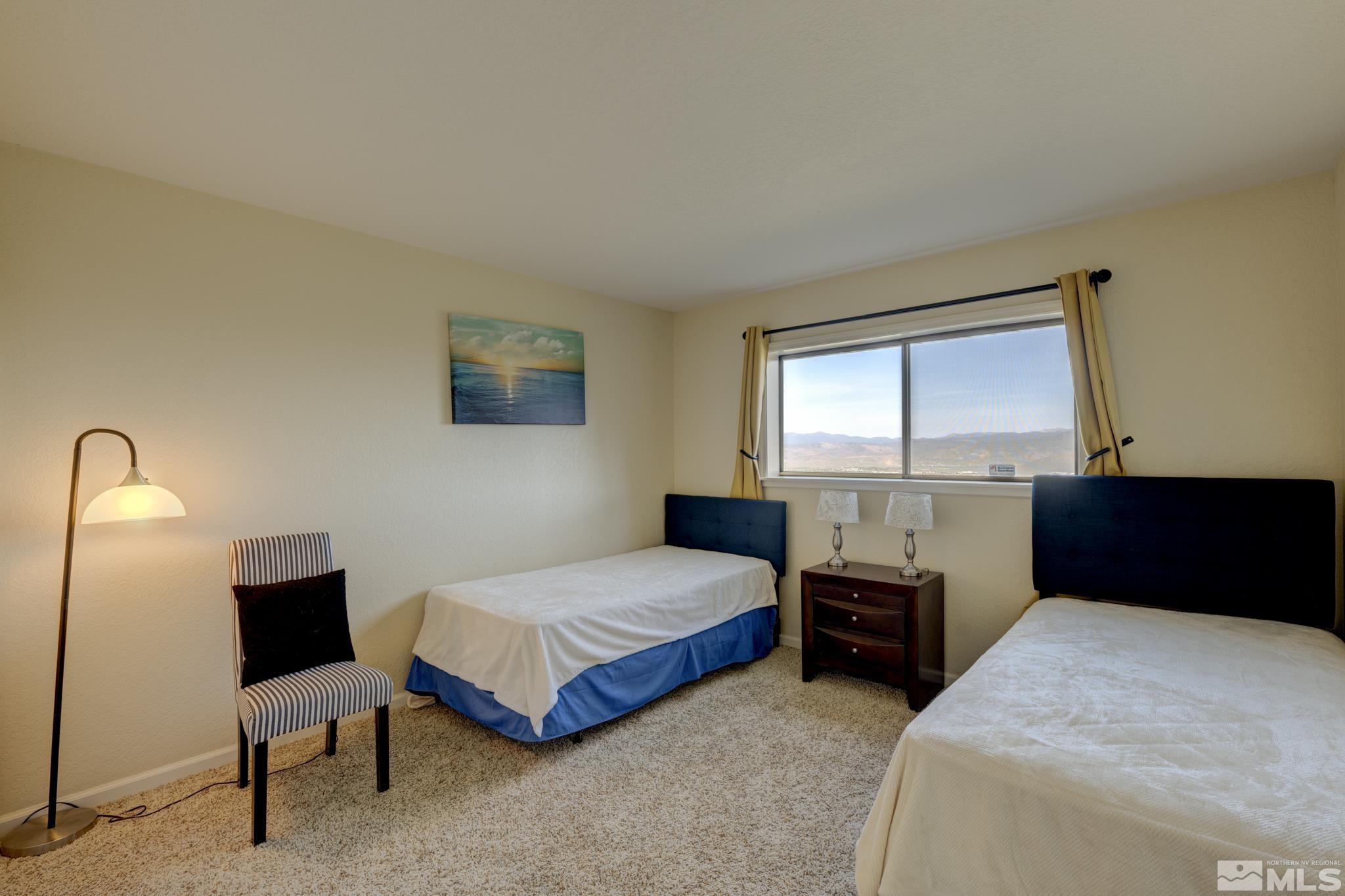 3760 Paradise View Carson City, NV 89703 - Photo 28 of 40 a bedroom with two beds and a window