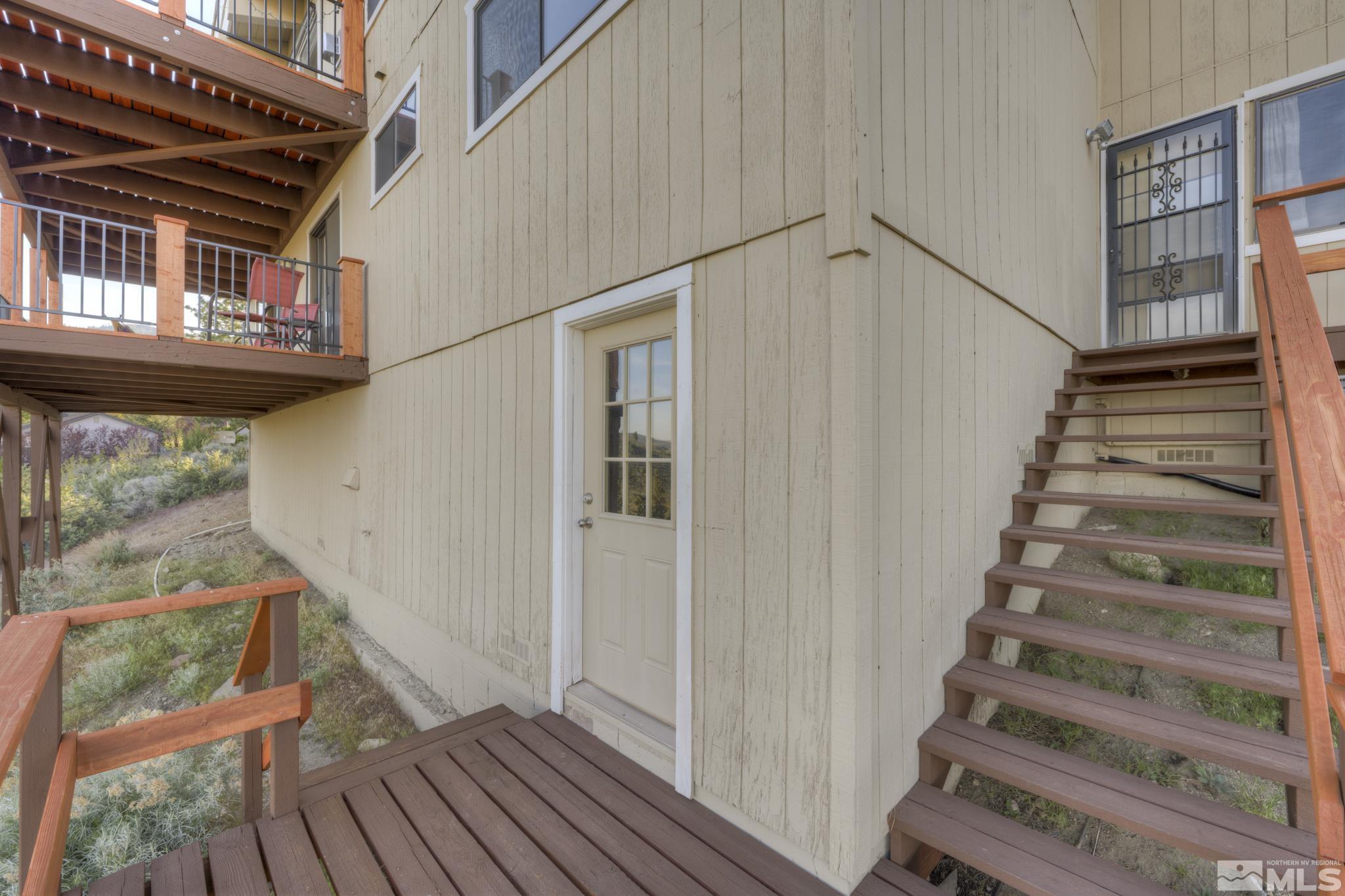 3760 Paradise View Carson City, NV 89703 - Photo 32 of 40 a view of entryway with wooden floor and stairs