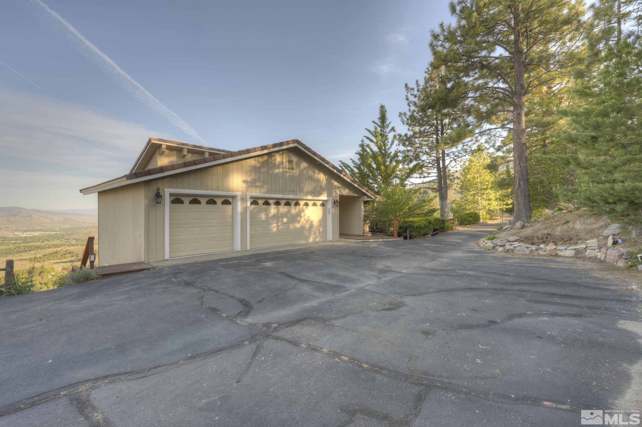 3760 Paradise View Carson City, NV 89703 - Photo 35 of 40 a view of a house with a yard and garage