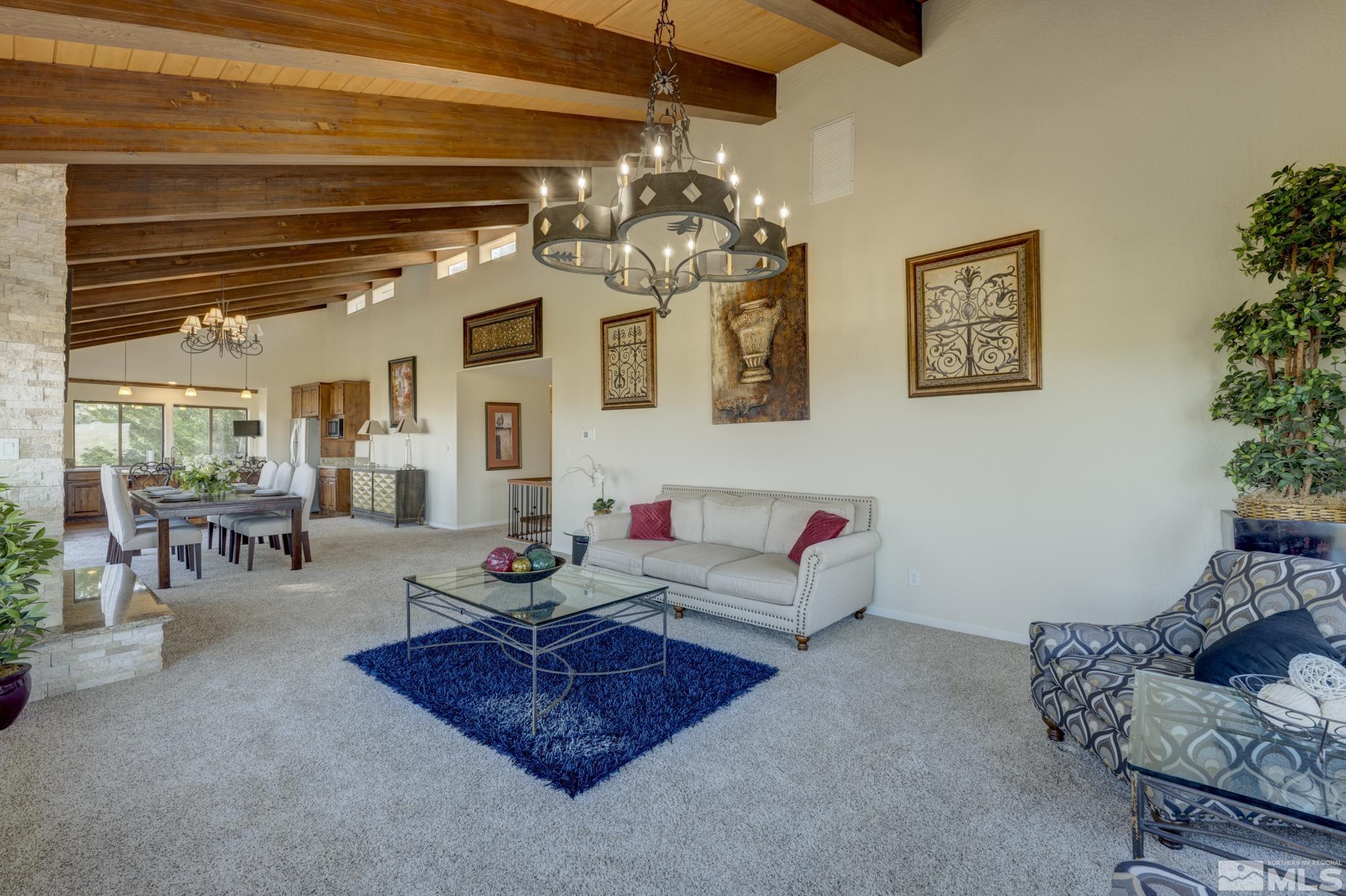 3760 Paradise View Carson City, NV 89703 - Photo 8 of 40 a living room with furniture and a chandelier