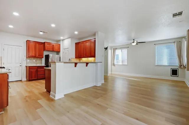 a view of kitchen with furniture and wooden floor
