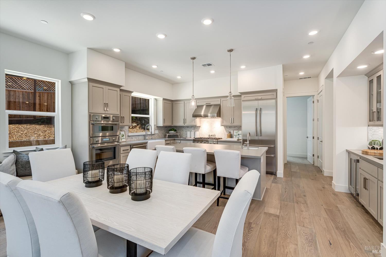 107 Grace Lane Napa, CA 94559 - Photo 11 of 39 a kitchen with white cabinets and stainless steel appliances