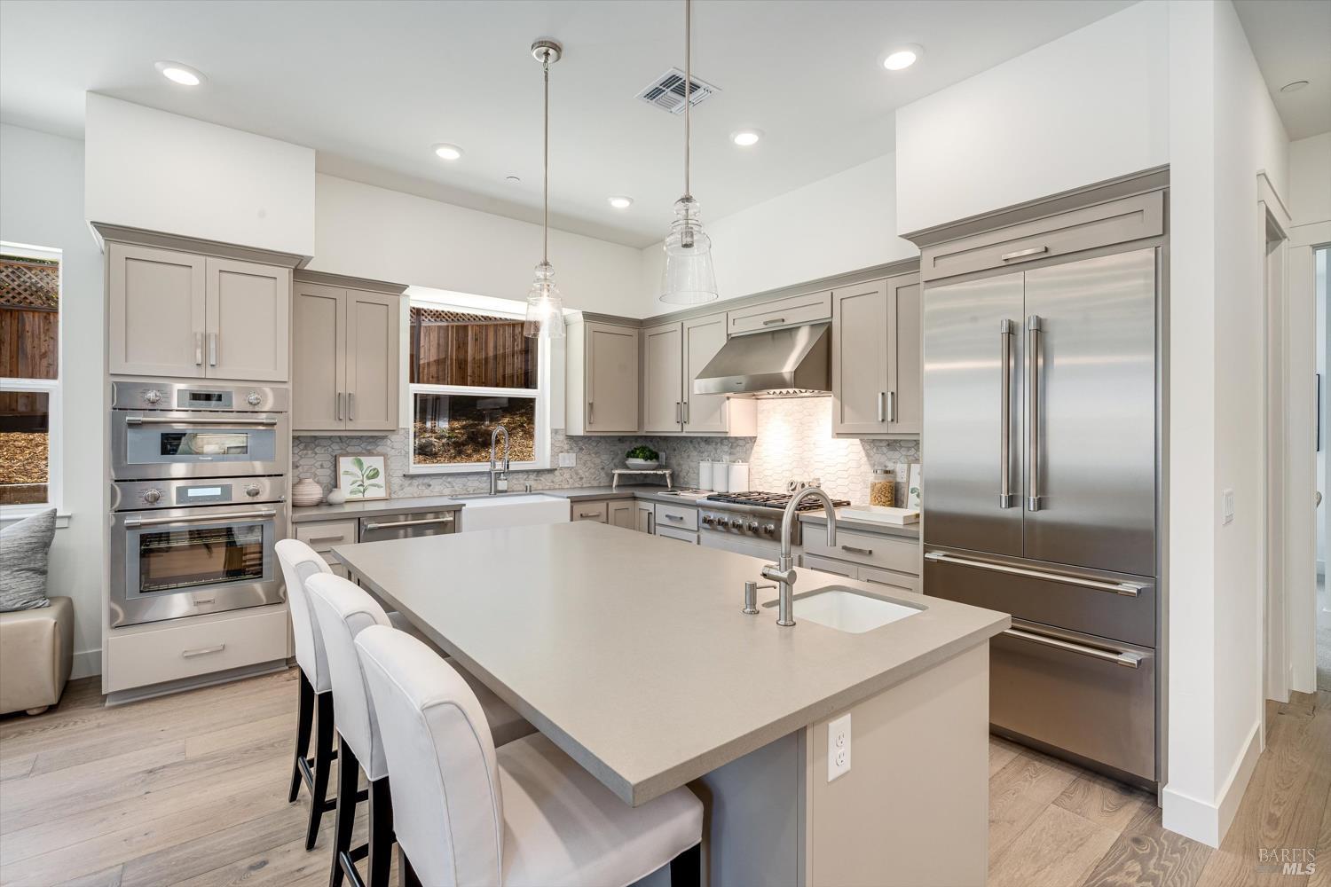 107 Grace Lane Napa, CA 94559 - Photo 13 of 39 a kitchen with kitchen island a sink counter and stainless steel appliances